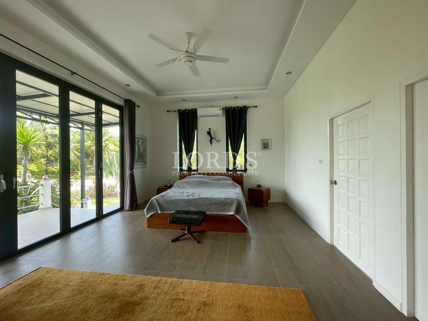 Spacious, modern bedroom with natural light