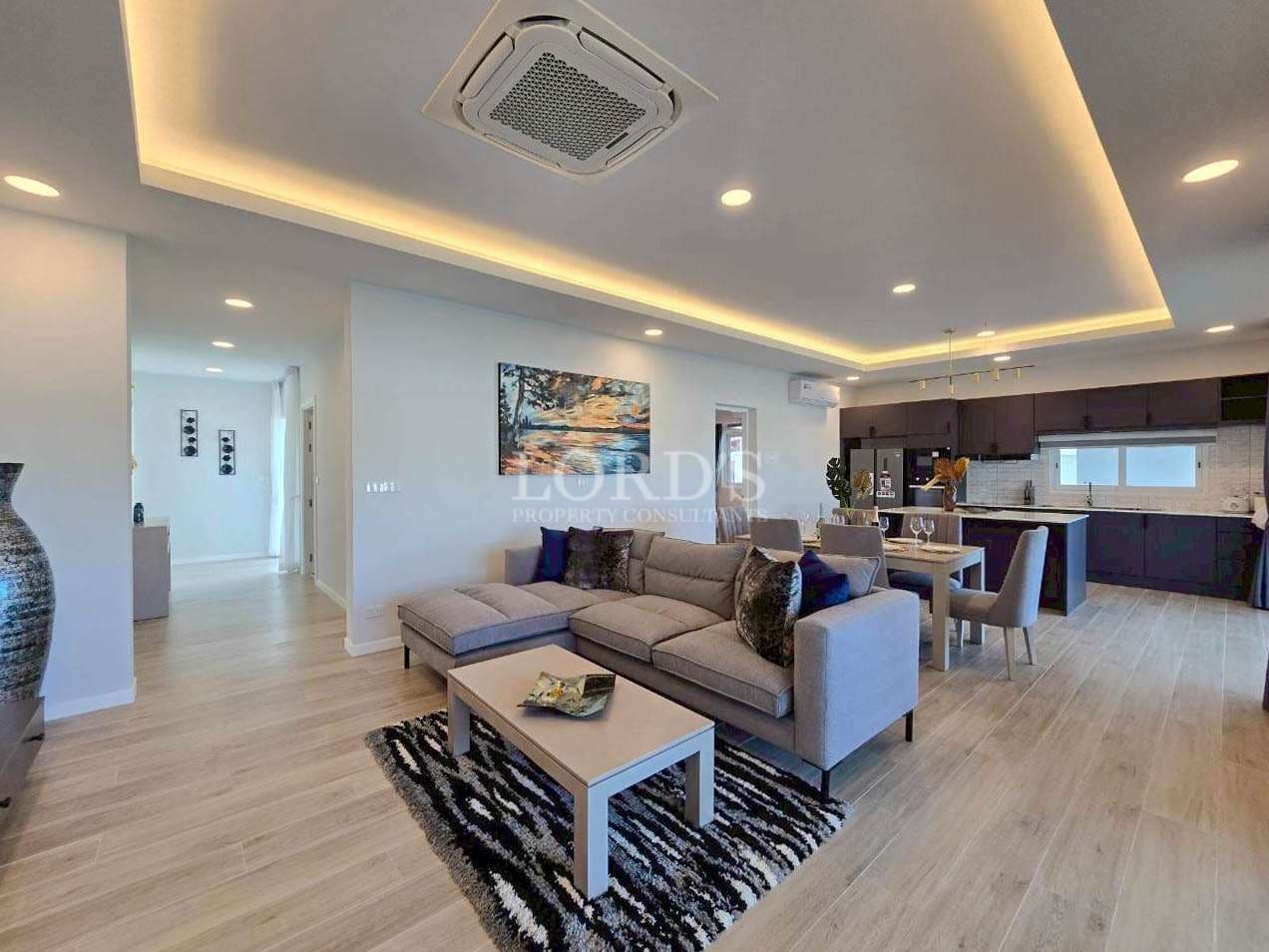 Modern living room with kitchen area