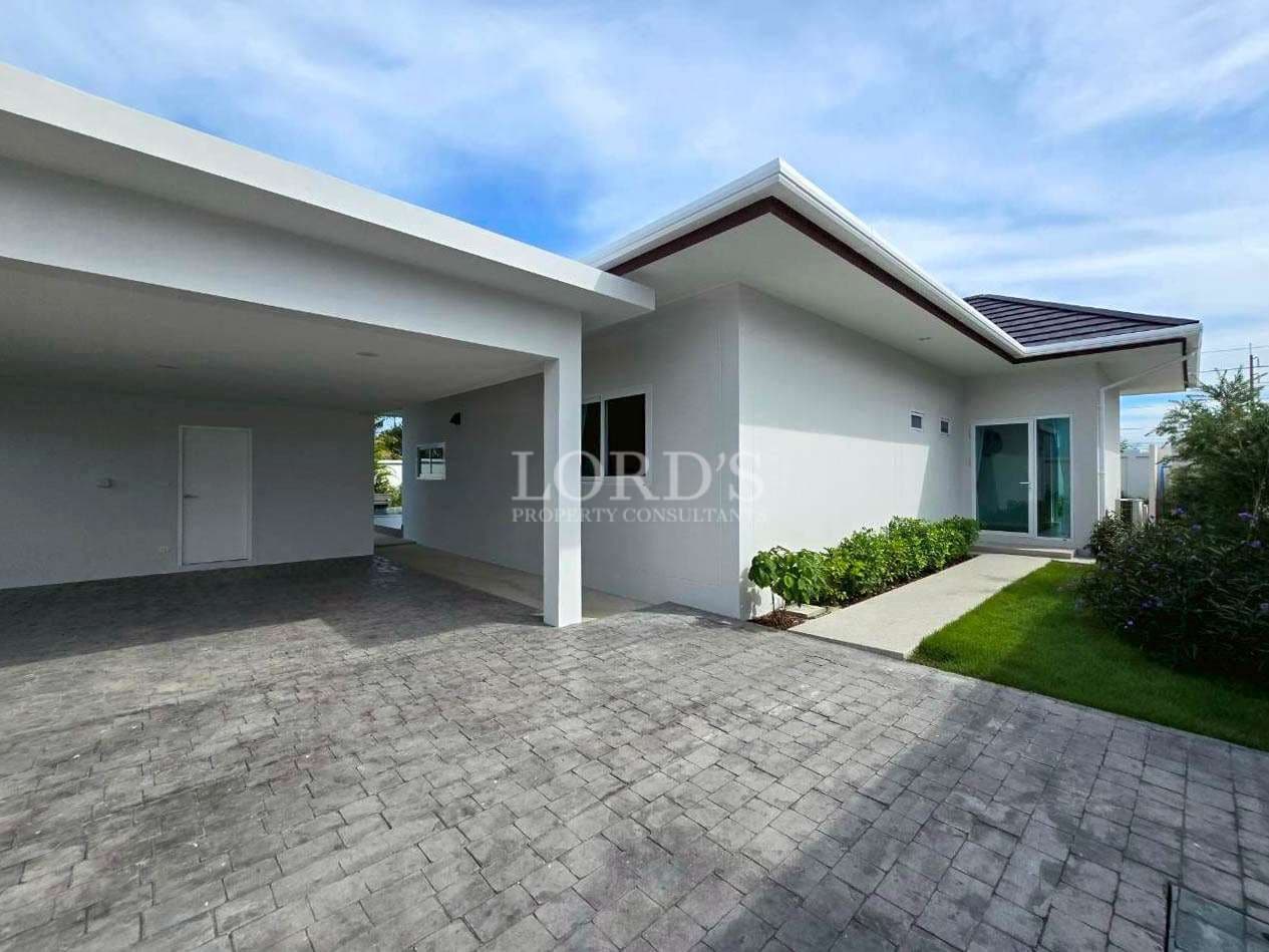 Modern house with driveway and garden