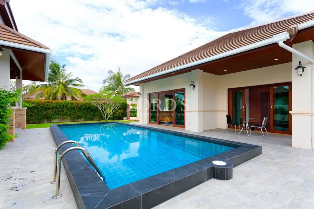 Luxury pool villa with private swimming pool, covered terrace, and modern tropical architecture