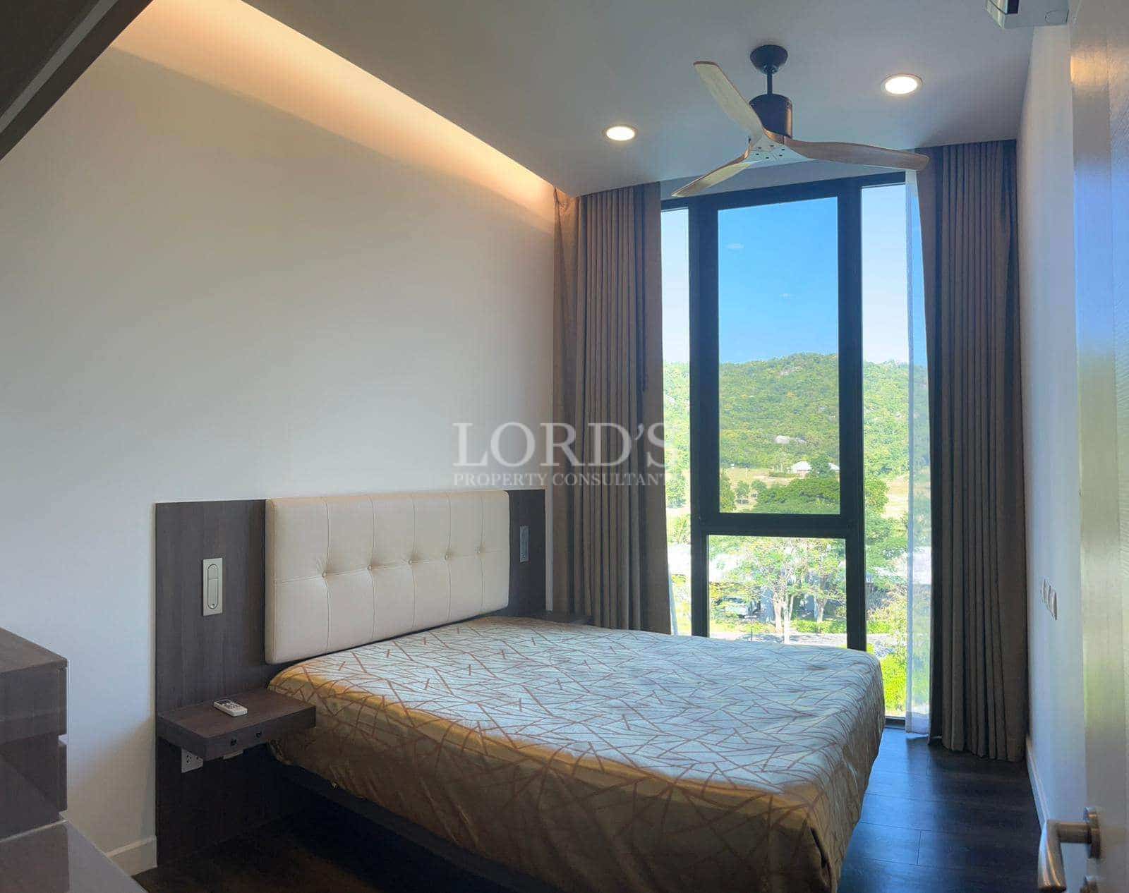 Modern bedroom with large window