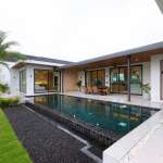 Modern single-story villa with private swimming pool, covered patio, palm tree landscaping, and open indoor–outdoor living.