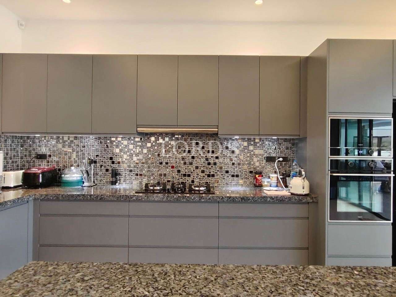 Modern kitchen with mosaic backsplash