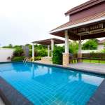 Modern poolside with covered seating