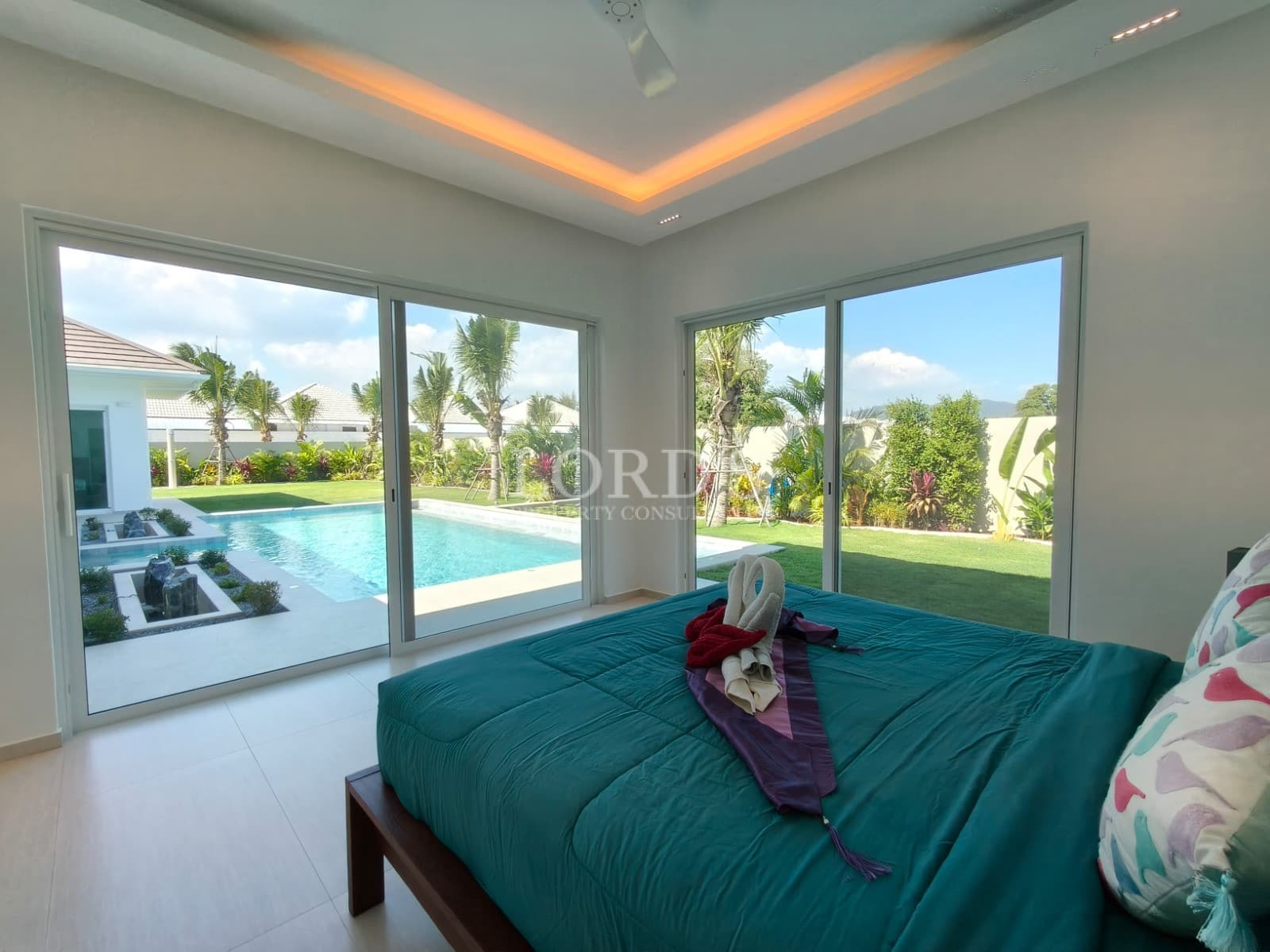 Bright bedroom with pool view