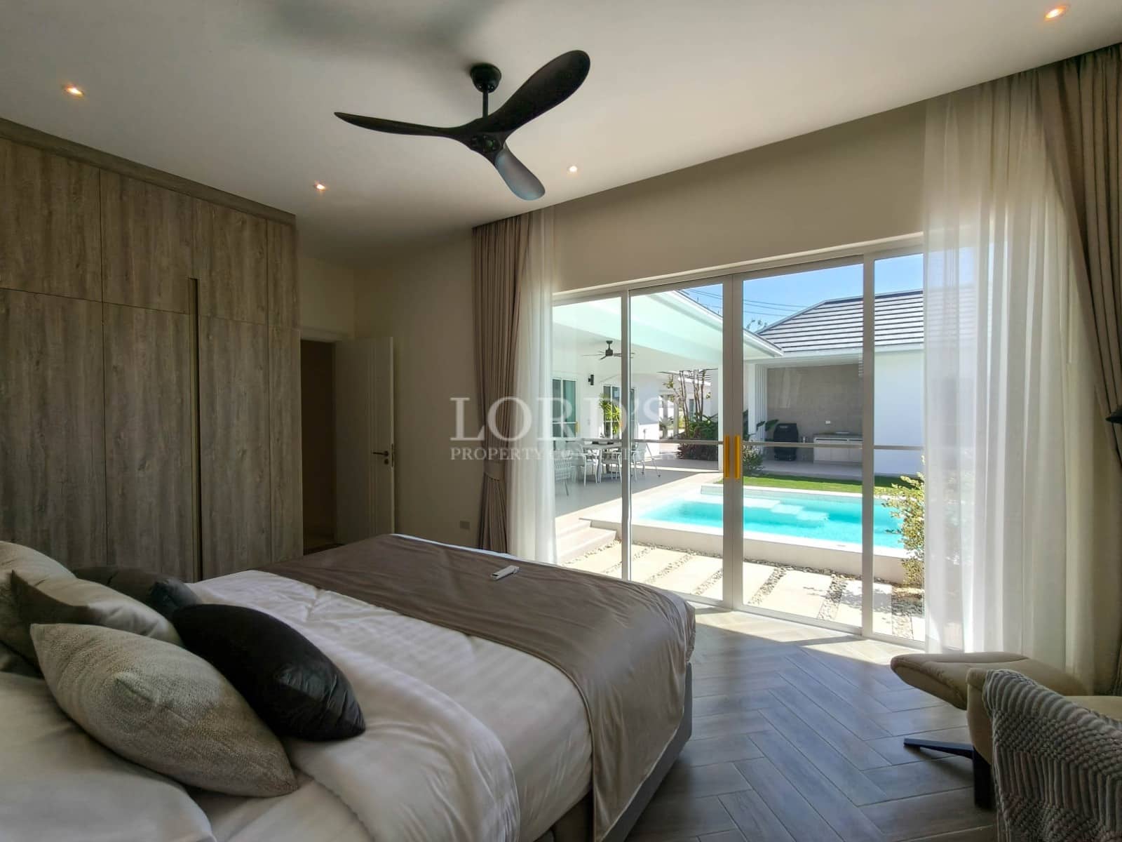 Modern bedroom with pool view
