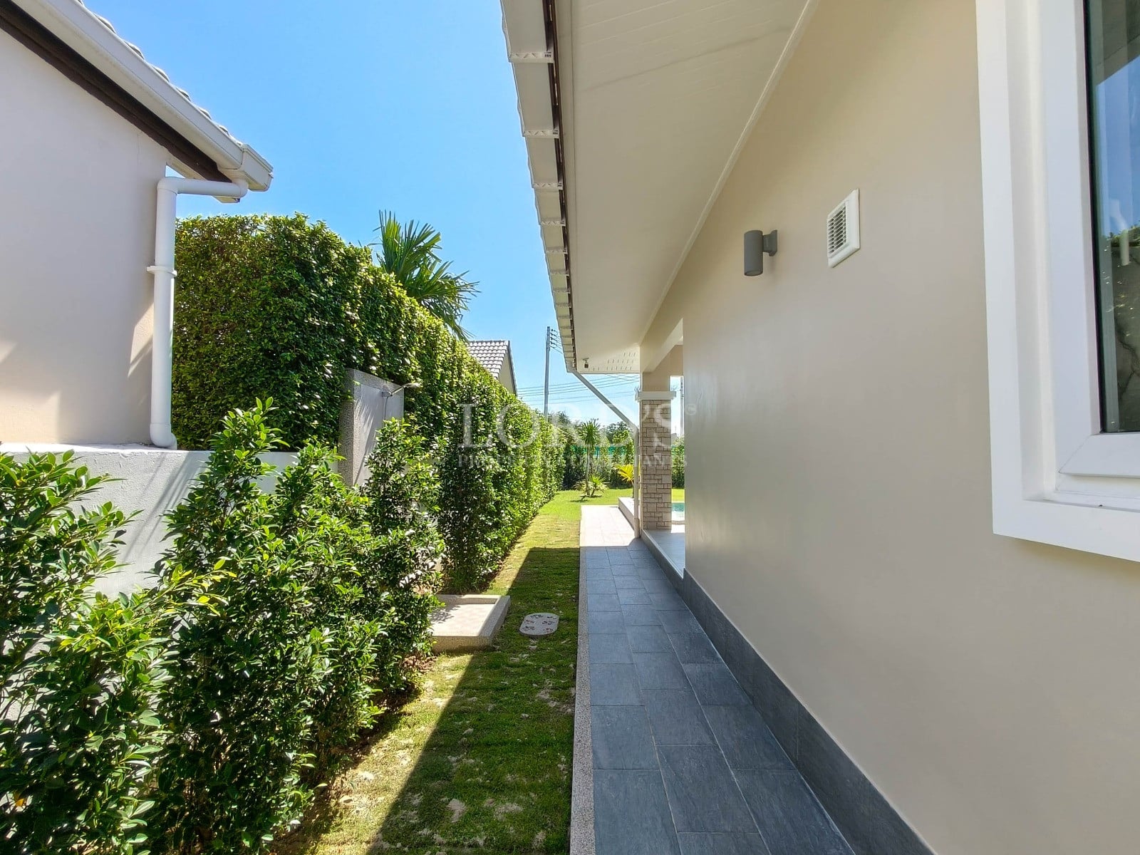 Pathway beside modern house exterior
