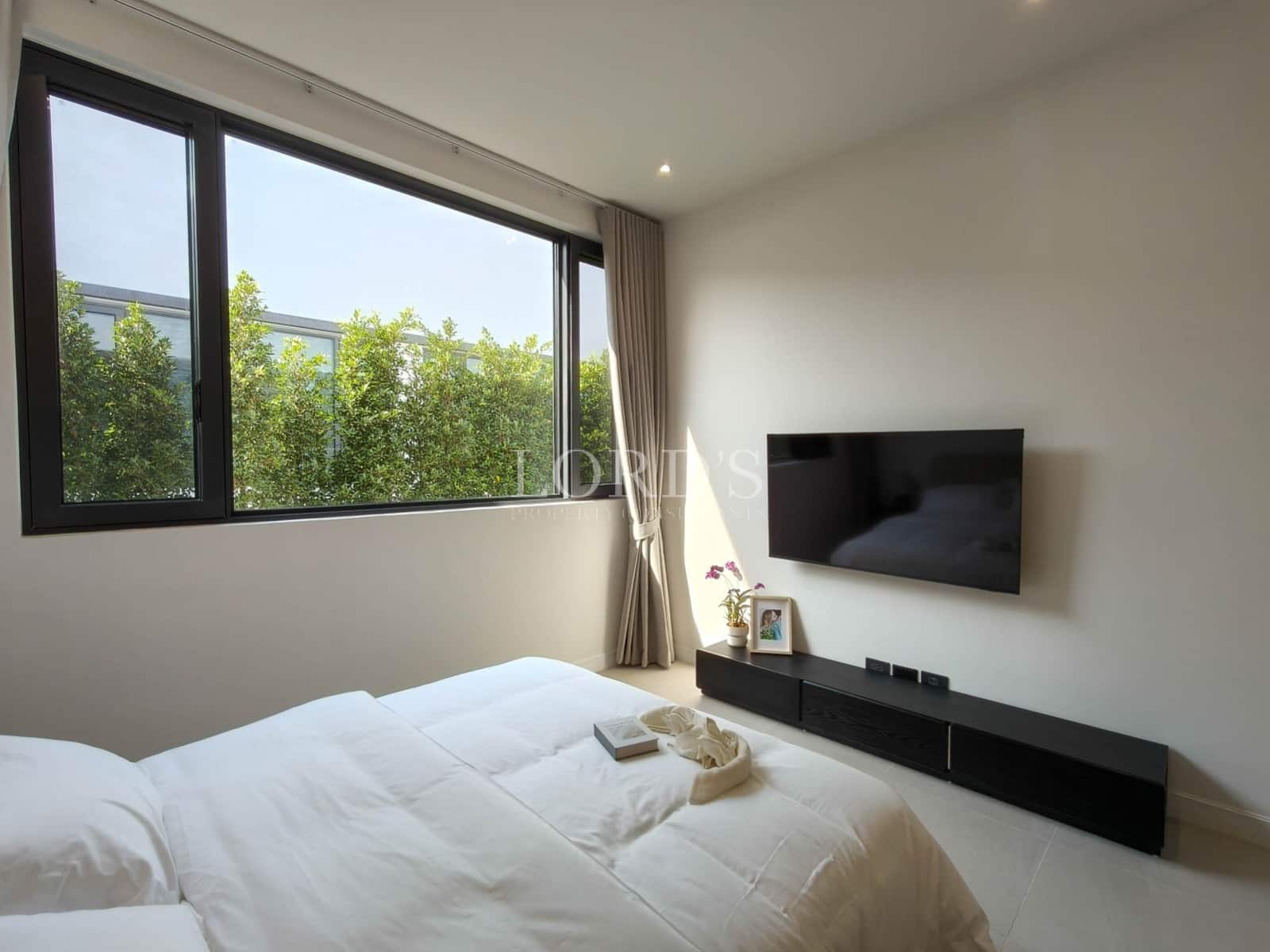 Modern bedroom with large window