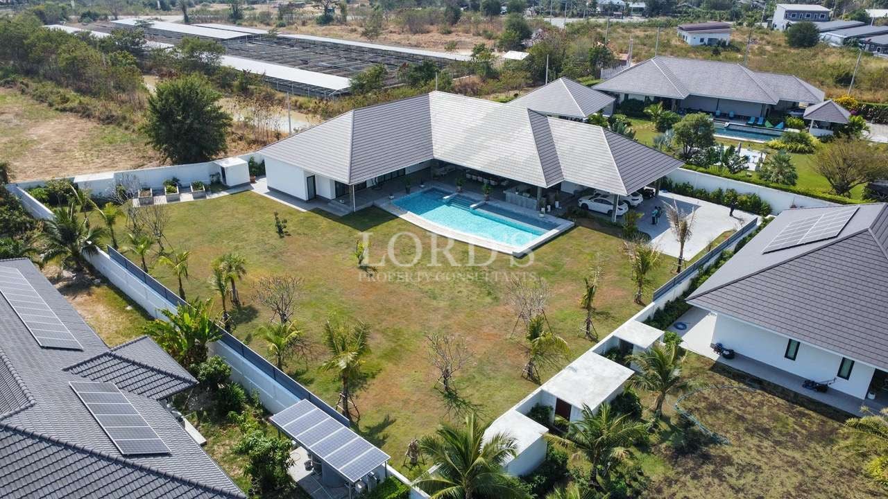 Aerial view of luxurious villa complex.