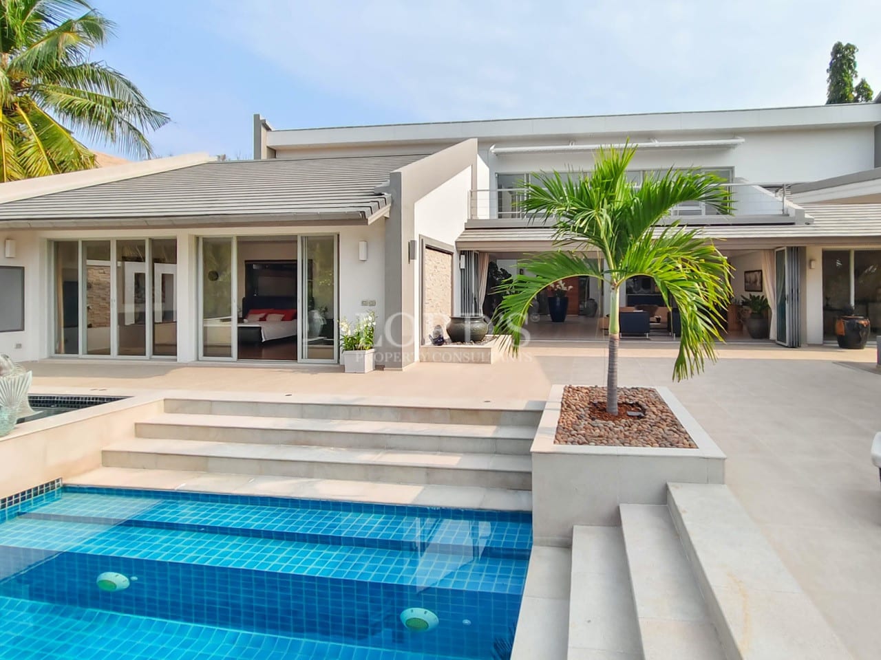 Modern luxury villa with private swimming pool and open courtyard design.